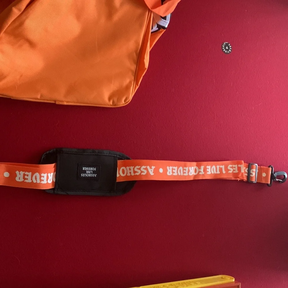 Assholes live forever Linda finegold duffel bag in orange